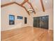Vaulted ceiling with exposed beams and natural light through windows at 1425 Sky Vista Way, Raleigh, NC 27613