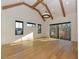 Living room featuring a vaulted ceiling with exposed beams, and natural light at 1425 Sky Vista Way, Raleigh, NC 27613