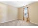 Neutral bedroom features carpet flooring, a window with drapes, and ample natural light at 1732 Great Bend Dr, Durham, NC 27704
