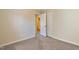 This bedroom has carpet flooring, neutral paint, and two doors at 1732 Great Bend Dr, Durham, NC 27704