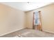 Neutral bedroom features carpet flooring, a window with drapes, and ample natural light at 1732 Great Bend Dr, Durham, NC 27704