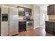 The kitchen features modern stainless steel appliances, wooden floors, and dark cabinets at 1732 Great Bend Dr, Durham, NC 27704