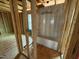 Unfinished bathroom with wood framing and a bathtub at 2155 Pink Peony Cir # 235, Durham, NC 27703