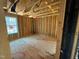 Unfinished bedroom featuring wood framing, subfloor and a window for natural light at 2155 Pink Peony Cir # 235, Durham, NC 27703