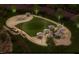 Community common area with outdoor seating, fire pit, and walking paths, perfect for relaxing evenings at 2155 Pink Peony Cir # 235, Durham, NC 27703