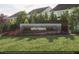 Welcome to Sweetbrier - A beautiful community sign surrounded by lush landscaping and colorful flowers at 2155 Pink Peony Cir # 235, Durham, NC 27703