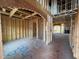 Interior framing with visible studs showcasing the structure of the new home at 2155 Pink Peony Cir # 235, Durham, NC 27703