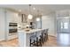 Modern kitchen featuring white cabinets, stainless steel appliances, a kitchen island, and pendant lighting at 2155 Pink Peony Cir # 235, Durham, NC 27703
