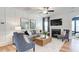 Elegant living room with a fireplace, modern furniture, and decorative artwork, creating an inviting and sophisticated ambiance at 2155 Pink Peony Cir # 235, Durham, NC 27703