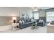 Cozy living room featuring a sectional sofa, decorative pillows, and a modern coffee table, creating a comfortable space at 2155 Pink Peony Cir # 235, Durham, NC 27703