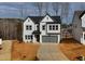 Two-story house with gray-trimmed siding, and a two-car garage at 5168 Church Rd # 22, New Hill, NC 27562