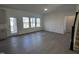 Bright living room featuring hardwood floors, many windows, and an open floor plan at 5168 Church Rd # 22, New Hill, NC 27562