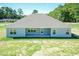 Aerial view of the rear exterior showcasing the home's covered patio and spacious backyard at 587 Glenkirk Pl, Garner, NC 27529