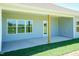 The large, covered back patio has wooden posts and a concrete floor at 587 Glenkirk Pl, Garner, NC 27529