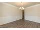 Formal dining room features chair rail and classic chandelier at 587 Glenkirk Pl, Garner, NC 27529