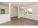Elegant dining room featuring beautiful hardwood floors, detailed trim and large windows for natural light at 587 Glenkirk Pl, Garner, NC 27529