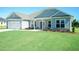 Beautiful single-story home with green grass at 587 Glenkirk Pl, Garner, NC 27529