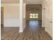 Open-concept living area boasting wood-look floors and plenty of natural light at 587 Glenkirk Pl, Garner, NC 27529
