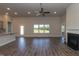 Spacious living area with a modern fireplace and backyard views at 587 Glenkirk Pl, Garner, NC 27529