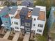 Modern townhomes feature rooftop decks, solar panels, and contemporary exterior designs, offering stylish urban living at 612 Rocky Knob Ct, Raleigh, NC 27601