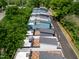 The rooftop decks, solar panels, and modern designs are on display in this aerial view of the townhome community at 612 Rocky Knob Ct, Raleigh, NC 27601