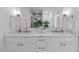 Bathroom features a double sink vanity with marble countertop and modern fixtures at 612 Rocky Knob Ct, Raleigh, NC 27601