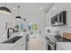 Well-lit kitchen showcases modern appliances, sleek white cabinetry, and an inviting open layout at 612 Rocky Knob Ct, Raleigh, NC 27601