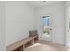 Entry with bench seating and access to an outdoor space with a modern glass door at 612 Rocky Knob Ct, Raleigh, NC 27601