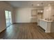 Kitchen with an island, light gray cabinets, and wood-look floors at 6856 Galloway Dr, Middlesex, NC 27557