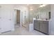 Modern bathroom with glass shower, neutral colors, and marble-look tile at 909 Jasper Mine Trl, Raleigh, NC 27610