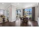 Bright dining area features hardwood floors, large windows and sliding door with porch access at 909 Jasper Mine Trl, Raleigh, NC 27610