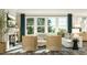 Cozy living room featuring a fireplace, comfortable seating, natural light, and contemporary decor at 913 Jasper Mine Trl, Raleigh, NC 27610
