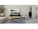 Cozy living room showcasing modern furniture, a decorative rug, and a view of the lake at 913 Jasper Mine Trl, Raleigh, NC 27610