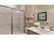 Modern bathroom featuring a marble tiled shower, and sleek vanity with neutral accents at 921 Jasper Mine Trl, Raleigh, NC 27610