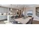 Kitchen with light gray cabinetry, stainless appliances and island seating at 921 Jasper Mine Trl, Raleigh, NC 27610