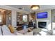 Open living space with fireplace, dining area, and comfortable seating at 921 Jasper Mine Trl, Raleigh, NC 27610