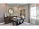 Stylish office space with a dark wood desk, comfortable seating, neutral colors, and plenty of natural light at 921 Jasper Mine Trl, Raleigh, NC 27610