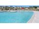 Community pool featuring a splash pad and ample lounge seating with lush community landscaping at 921 Jasper Mine Trl, Raleigh, NC 27610