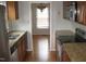 Kitchen with granite countertops, stainless steel appliances, and hardwood floors at 1307 Castalia Dr, Cary, NC 27513