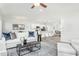Bright living space open to kitchen, featuring modern furnishings, hardwood floors, and great natural light at 1319 Hollyview Ave, Durham, NC 27703
