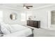 Bright and spacious main bedroom with white walls, recessed lights, large window and decorative ceiling at 1319 Hollyview Ave, Durham, NC 27703