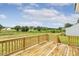 Large wooden deck overlooking the backyard and surrounding nature at 243 Kissington Way, Benson, NC 27504