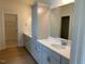 Double sink bathroom with plenty of cabinet space for storage at 243 Kissington Way, Benson, NC 27504