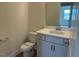 Neat half bathroom featuring a sink and toilet at 243 Kissington Way, Benson, NC 27504