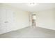 Bright bedroom with neutral tones, plush carpet, and large closet at 243 Kissington Way, Benson, NC 27504