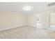 Spacious carpeted bedroom with neutral walls, and access to multiple rooms at 243 Kissington Way, Benson, NC 27504