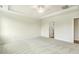 Spacious bedroom featuring neutral walls, plush carpet, ceiling fan, and a tray ceiling at 243 Kissington Way, Benson, NC 27504
