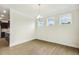 Bright dining room with wood floors and three windows providing natural light at 243 Kissington Way, Benson, NC 27504