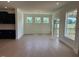 Bright dining area with a chandelier and sliding door access to a balcony at 243 Kissington Way, Benson, NC 27504