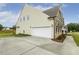 Exterior view of home with a two-car garage and concrete driveway at 243 Kissington Way, Benson, NC 27504
